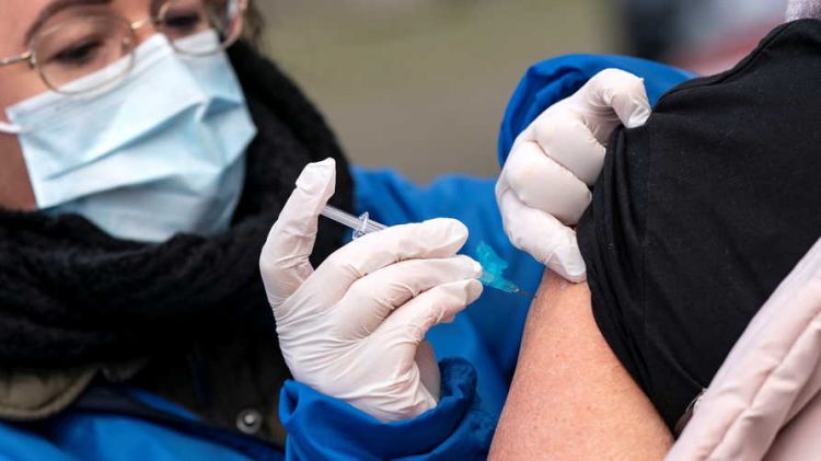 A member of nursing staff vaccinates a person against influenza as vaccination to high risk group patients is administered outdoors to prevent the spread of the coronavirus disease (COVID-19), in Trelleborg, southern Sweden November 19, 2020.   TT News Agency/Johan Nilsson via REUTERS      ATTENTION EDITORS - THIS IMAGE WAS PROVIDED BY A THIRD PARTY. SWEDEN OUT. NO COMMERCIAL OR EDITORIAL SALES IN SWEDEN.