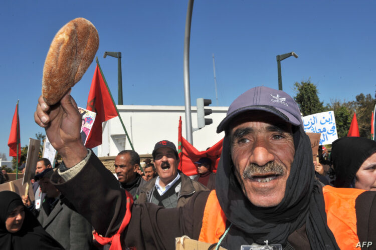 A Moroccan army veteran, who was held prisoner by Polisario fighters, holds a bread loaf as he gathers along with others veterans and their relatives during a demonstration to ask for ''justice and dignity'' and a pension increase to the King on February 23, 2012 in Rabat. Morocco annexed Western Sahara in 1976 after a Spanish withdrawal, and Polisario fighters took up arms for an independent state. AFP PHOTO / ABDELHAK SENNA