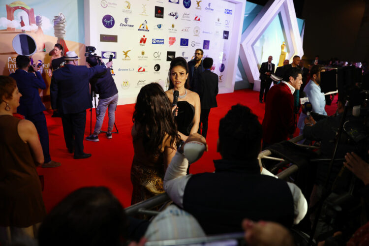 (220224) -- ASWAN, Feb. 24, 2022 (Xinhua) -- Guests attend the red-carpet ceremony of the 6th Aswan International Women Film Festival in Aswan, Egypt, Feb. 23, 2022. The 6th Aswan International Women Film Festival (AIWFF) kicked off on Wednesday with a red-carpet ceremony attended by dozens of Egyptian and foreign artists, filmmakers and critics. (Xinhua/Ahmed Gomaa)