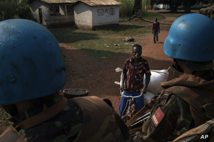 Moroccan UN peacekeepers patrol the town of Bangassou, Central African Republic, Monday Feb. 15, 2021. An estimated 240,000 people have been displaced in the country since mid-December, according to U.N. relief workers, when rebels calling themselves the Coalition of Patriots for Change launched attacks, causing a humanitarian crisis in the already unstable nation. (AP Photo/Adrienne Surprenant)