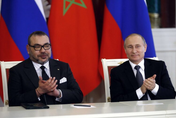 Russian President Vladimir Putin (R) and Moroccan King Mohammed VI attend a signing ceremony following their meeting at the Kremlin in Moscow on March 15, 2016. AFP PHOTO / POOL / MAXIM SHIPENKOV