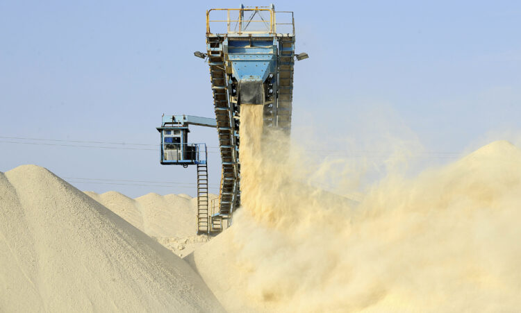 A picture taken on May 13, 2013 shows untreated phosphate being dropped off on a montain at the end of a conveyor belt at the Marca factory of the National Moroccan phosphates company (OCP/public), near Laayoune, the capial of Moroccan-controlled Western Sahara. As a global leader in the market for phosphate and its derivatives, OCP has been a key player in the international market since its founding in 1920, the worlds largest exporter of phosphate rock and phosphoric acid and one of the worlds largest fertilizer producers.    AFP PHOTOS/FADEL SENNA / AFP PHOTO / FADEL SENNA