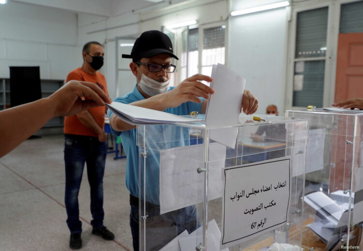 A man casts his vote at a polling station during parliamentary and local elections, in Casablanca, Morocco September 8, 2021. REUTERS/Abdelhak Balhaki