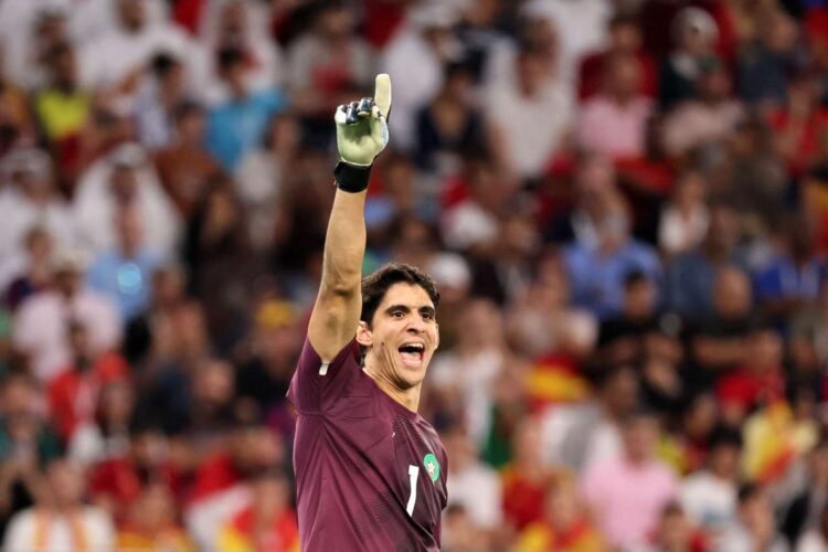 Morocco's goalkeeper #01 Yassine Bounou gestures during the Qatar 2022 World Cup round of 16 football match between Morocco and Spain at the Education City Stadium in Al-Rayyan, west of Doha on December 6, 2022. (Photo by KARIM JAAFAR / AFP)