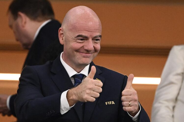 (FILES) In this file photo taken on November 28, 2022 FIFA President Gianni Infantino gives thumbs-up during the Qatar 2022 World Cup Group G football match between Brazil and Switzerland at Stadium 974. - Gianni Infantino has been re-elected as president of FIFA until 2027 after standing unopposed at the congress of world football's governing body in Kigali on March 16, 2023. (Photo by Fabrice COFFRINI / AFP)