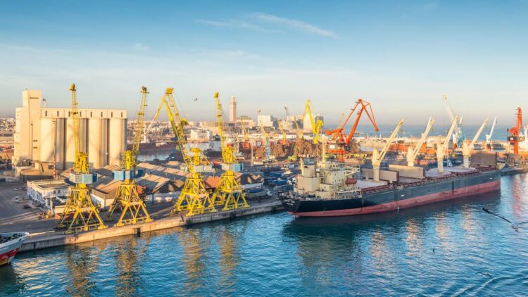 Casablanca, Morocco - December 8, 2016: Cargo vessel Ocean Luck (Bulk Carrier) early in the morning in the seaport of Casablanca, Morocco. The scene with harbor cranes, elevators, ships and export cargoes in the port. (Casablanca, Morocco - December 8