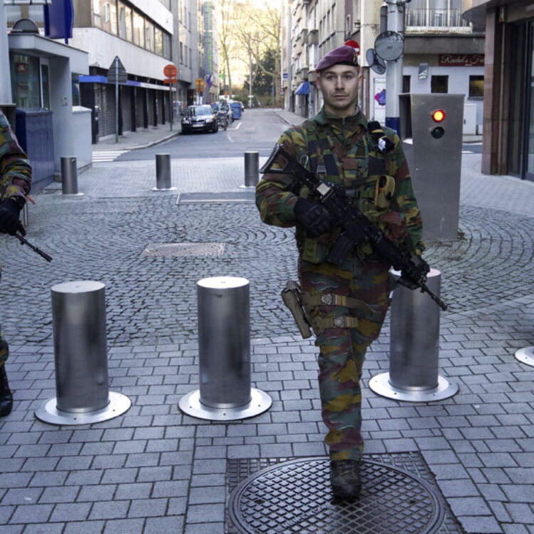 Belgian soldiers patrol in Antwerp on January 17, 2015 after security forces smashed a suspected Islamist "terrorist" cell planning to kill police officers. Up to 300 soldiers will be progressively deployed in the capital Brussels and the northern city of Antwerp, which has a large Jewish population, Prime Minister Charles Michel's office said in a statement. Security forces early on January 16 killed two suspected Islamists in a huge raid in the eastern city of Verviers on an alleged jihadist cell planning to attack police in the country, and police arrested 13 people during a series of following raids across Belgium.  AFP PHOTO / BELGA / NICOLAS MAETERLINCK  **Belgium Out**