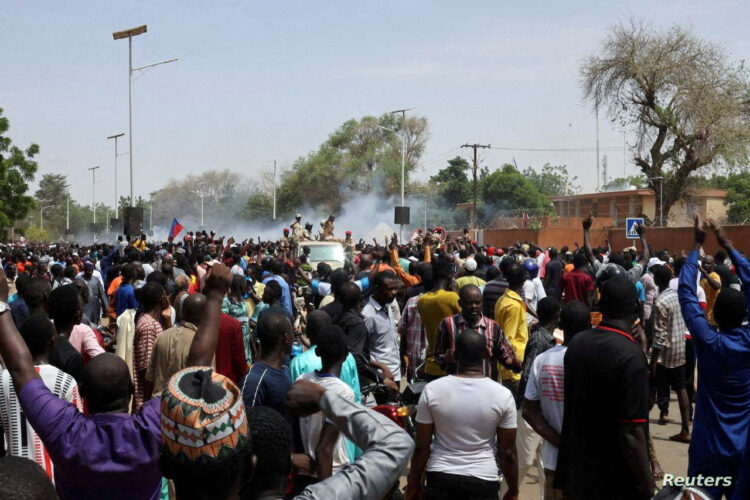 FILE PHOTO: Nigerien security forces launch tear gas to disperse pro-junta demonstrators gathered outside the French embassy, in Niamey, the capital city of Niger July 30, 2023. REUTERS/Souleymane Ag Anara/File Photo
