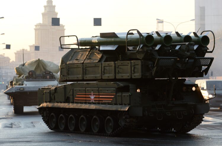 A BUK air defence missile system (R) moves on April 29, 2015 in Moscow for the Victory Day military parade night training. Russia celebrates the 70th anniversary of the 1945 victory over Nazi Germany on May 9. AFP PHOTO / VASILY MAXIMOV        (Photo credit should read VASILY MAXIMOV/AFP via Getty Images)