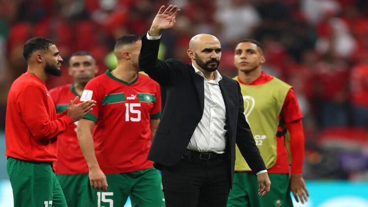 AL KHOR, QATAR - DECEMBER 14: Walid Regragui, Head Coach of Morocco, applauds fans after the 0-2 loss during the FIFA World Cup Qatar 2022 semi final match between France and Morocco at Al Bayt Stadium on December 14, 2022 in Al Khor, Qatar. (Photo by Lars Baron/Getty Images)