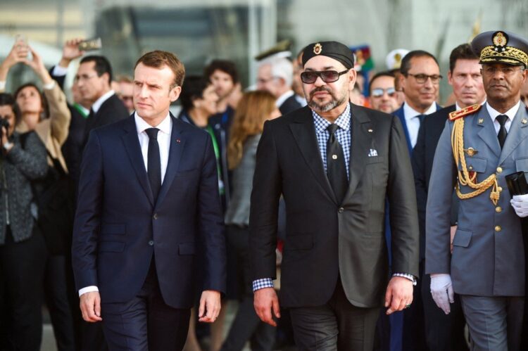 French President Emmanuel Macron (C-L) arrives with Morocco's King Mohamed VI (C-R) at Rabat Agdal train station for the inauguration of a high-speed railway line on November 15, 2018. French President Emmanuel Macron visits Morocco to take part in the inauguration of a high-speed railway line that boasts the fastest journey times in Africa or the Arab world. (Photo by FADEL SENNA / AFP)