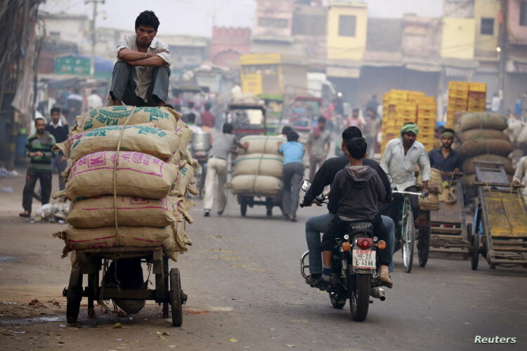 A labourer sits on a pushcart loaded with spices at a busy market in the old quarters of Delhi, India, February 29, 2016.Prime Minister Narendra Modi wants the federal budget unveiled on Monday to appeal to India's rural poor, officials familiar with his thinking said, in a strategy shift that could boost his ruling party in coming state elections but disappoint investors. REUTERS/Cathal McNaughton