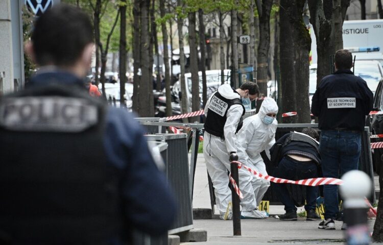 French police forensic investigators search for evidence near the Henry Dunant private hospital where one person was shot dead and one injured in a shooting outside the instituion owned by the Red Cross in Paris' upmarket 16th district on April 12, 2021. (Photo by Anne-Christine POUJOULAT / AFP)
