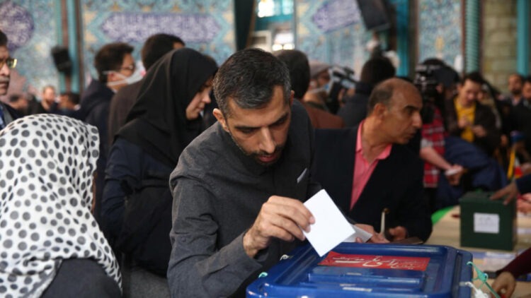 A man casts his vote during parliamentary elections at a polling station in Tehran, Iran February 21, 2020. Nazanin Tabatabaee/WANA (West Asia News Agency) via REUTERS ATTENTION EDITORS - THIS IMAGE HAS BEEN SUPPLIED BY A THIRD PARTY.