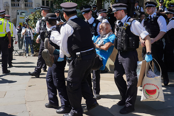 A large number of people sat with placards in Parliament Square stating they opposed genocide and supported Palestine Action and all were subsequently arrested on the 12th of July 2025, London, United Kingdom. It is the second Saturday running that people opposing the proscription of the group Palestine Action staged a protest in the square and a huge number of police and press turned out. The protest was organised by Defend Our Juries and similar protests took place in other parts of the country. The pro-Palestine direct action group Palestine Action was proscribed by an act of Parliament and the ban came into force Saturday July 5th 2025. The ban includes showing support of the group and the people were arrested under the terrorism act and will possibly be sentenced to lengthy prison sentences. Palestine Action has never hurt anyone but have targeted Israeli weapons companies in Britain and caused millions of pounds worth of damage in a stated attempt to save Palestinian lives in Gaza. (photo by Kristian Buus/In Pictures via Getty Images)